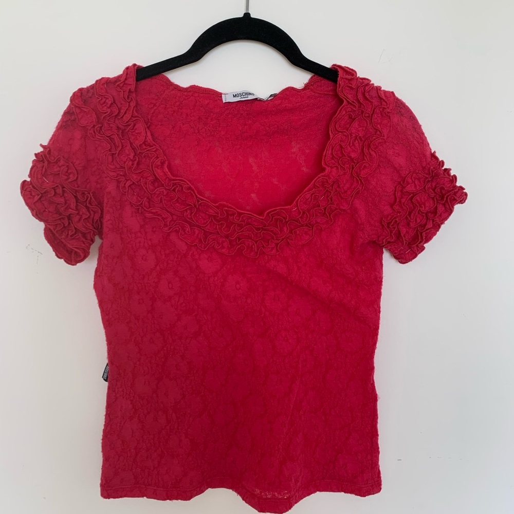 Red MOSCHINO frill-edged short sleeve shirt.